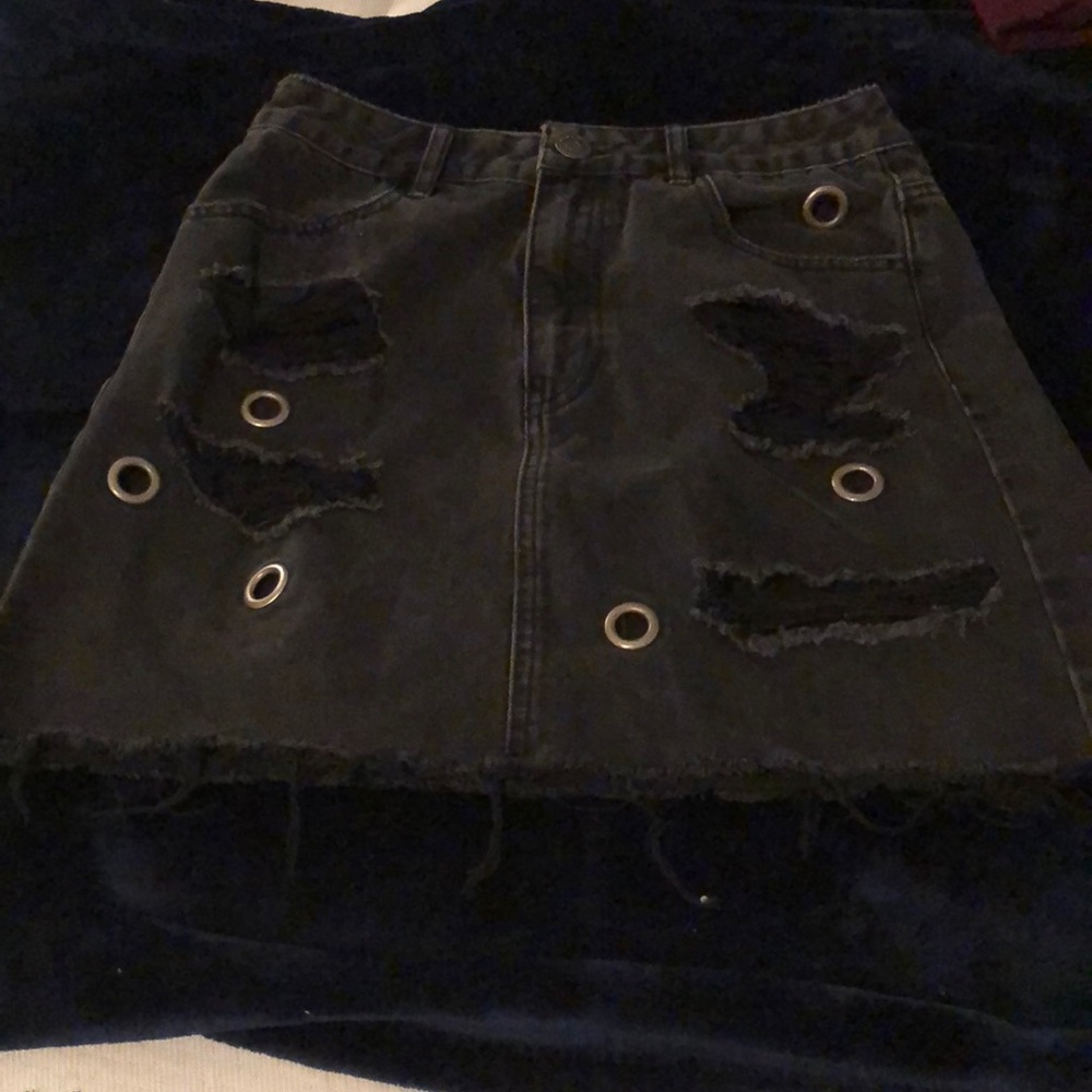 Distressed black denim skirt